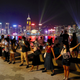 Demonstrators link hands as they gather at the Tsim Sha Tsui waterfront in Hong Kong.